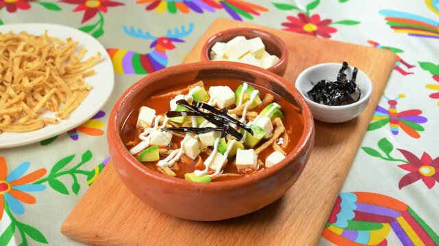Authentic Mexican cuisine. Traditional tortilla soup preparation with pasilla chili strips