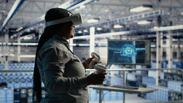IT specialist uses virtual reality in a data center to adjust AI configurations and improve processing speed.