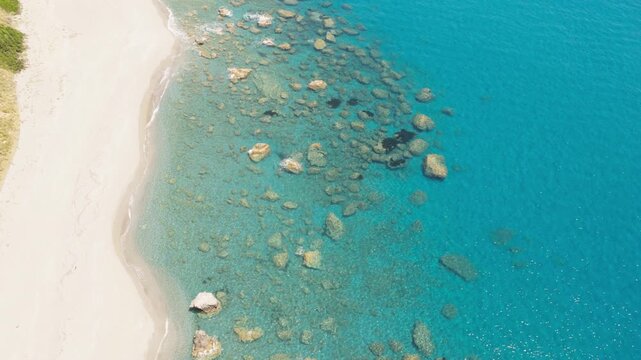 Rocky transparent waters in Calabria in the Mediterranean Sea in summer season