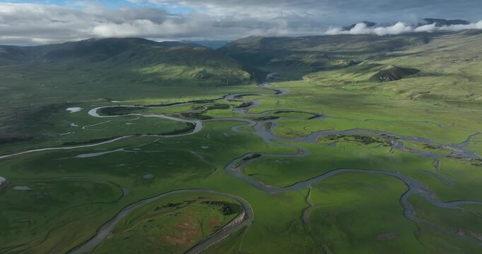 Beautiful curving rivers and green grassland in Litang county, China
