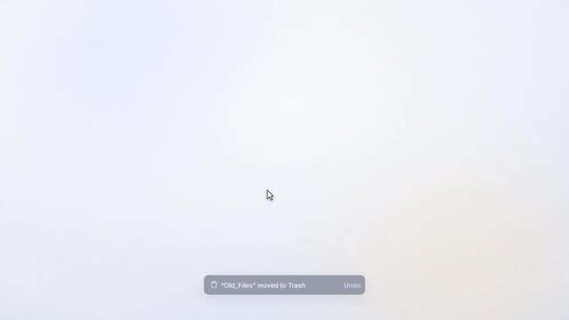 Old folder icon dissolving into particles as file gets deleted on light desktop interface