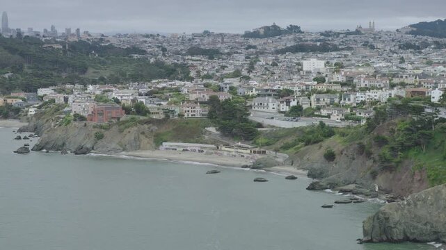 San Francisco Coastal Cove and Residential Hillside - Cinematic Aerial Shot At Overcast