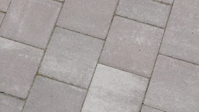 gray paving stones top view for pavement background with concrete block pattern and outdoor walkway