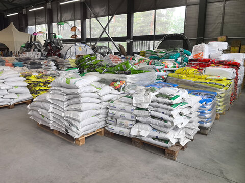Colorful display of garden supplies organized in a warehouse for easy access