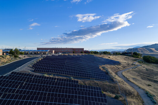 Aerial view of a large solar panel field near the Utah Data Center and Camp Williams Army Base in the hills of Bluffdale, Utah, United States.