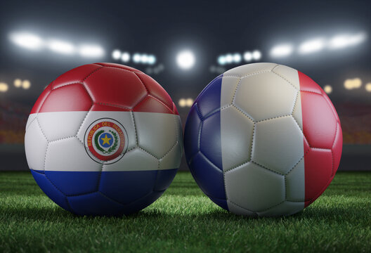 Two soccer balls in flags colors on a stadium blurred background. Paraguay vs France.