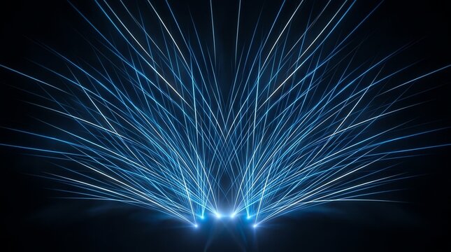 Electric blue light beams and sparkling energy rays form a dramatic glowing pattern over a dark surface, suggesting scientific technology and power transmission
