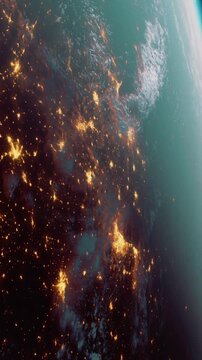Bright city lights glowing on Earths surface, mostly over land areas. The view captures the contrast of artificial lights and natural landscapes at night.