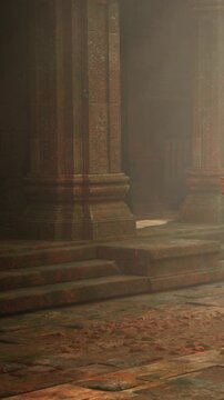 Visitors walk through ancient ruins at sunrise. The sunlight shines through the entrance, highlighting the detailed stone work and the worn steps leading inside.