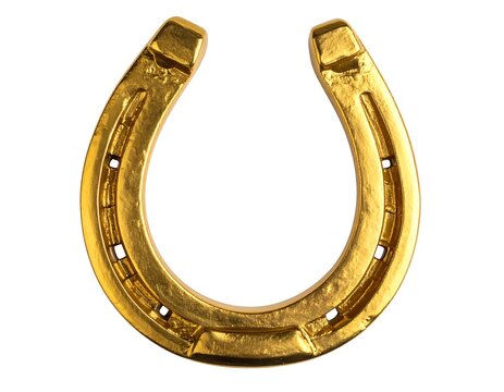Close-up of a golden horseshoe isolated against a white background. It symbolizes luck and fortune