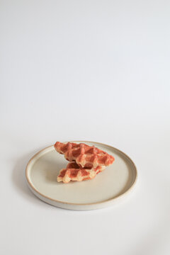 Croffle or Croissant Waffle on modern plate a delicious fusion of classic pastries promising delightful sweet treat for any occasion.