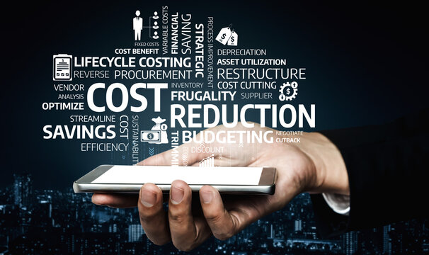 A businessman holds a smartphone displaying various terms related to cost reduction, budgeting, and efficiency, reflecting key concepts in corporate financial strategies. Tessel