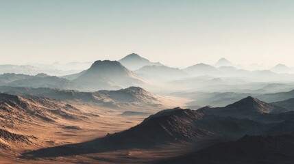 Obraz premium Vast arid mountain range with hazy peaks and desert valley