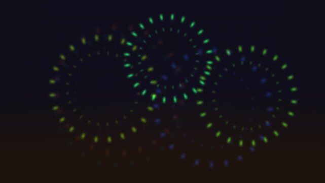 Colorful light circles create dynamic patterns in the dark