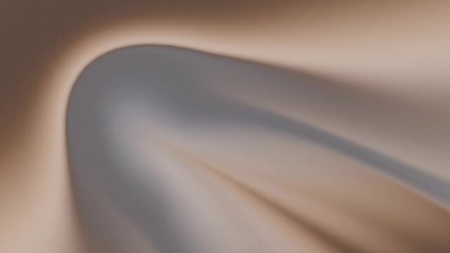 Soft blurry abstract gradient background in warm neutral tones.