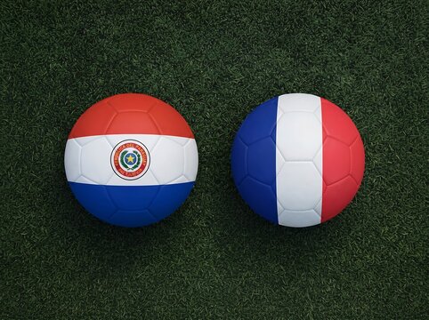 Two round spheres with paraguay and france national country flags against a dark background