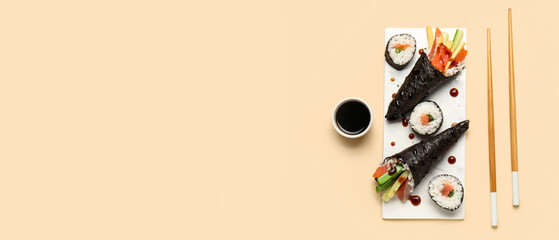Sushi hand rolls and maki with soy sauce and chopsticks © Pixel-Shot