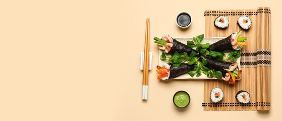 Sushi hand rolls and maki with soy sauce and wasabi © Pixel-Shot