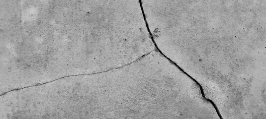 Obraz premium Cracked gray concrete surface texture with weathered cement pattern