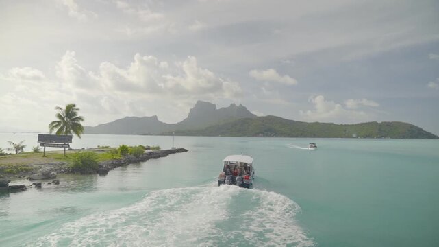Boat Cruising Through Turquoise Lagoon in Bora Bora