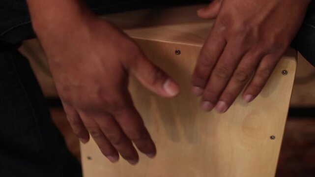 Hands Playing Cajon Percussion Instrument