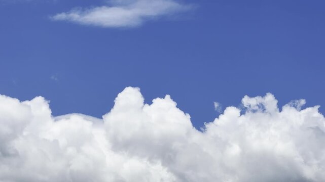 Cumulus clouds are clouds that have flat bases and are often described as puffy, cotton-like, or fluffy in appearance. Waikiki, City of Honolulu, Oahu, Hawaii. Trade Wind