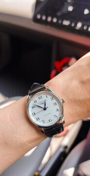 BANGKOK, THAILAND - JUNE 27 : Longines Master Collection, numeric marker, white dial in stainless steel case with alligator strap wear on wrist in Bangkok, Thailand, on June 27, 2026.