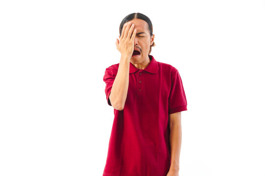 Asian man with long hair wearing a red shirt showing a gesture of boredom or fatigue, isolated on white background.