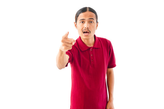 Close-up portrait of an angry Asian man with long hair wearing a red shirt, making a frustration gesture against a white background.