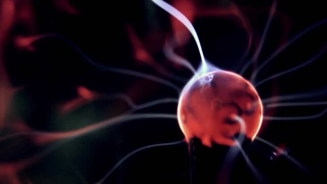 Close Up Of Plasma Lamp With Pink And Purple Electric Filaments