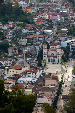 Aerial view of the historic city of Berat featuring the Holy Trinity Church and the Lead Mosque surrounded by traditional houses and stone streets in Berat, Berat County, Albania.