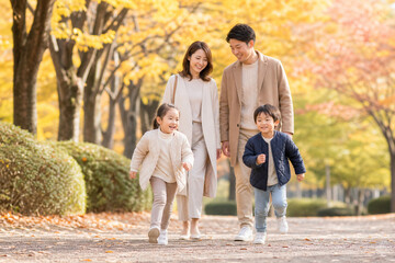Fototapeta premium 秋のイチョウ並木を走る子供と見守る両親 Generative AI