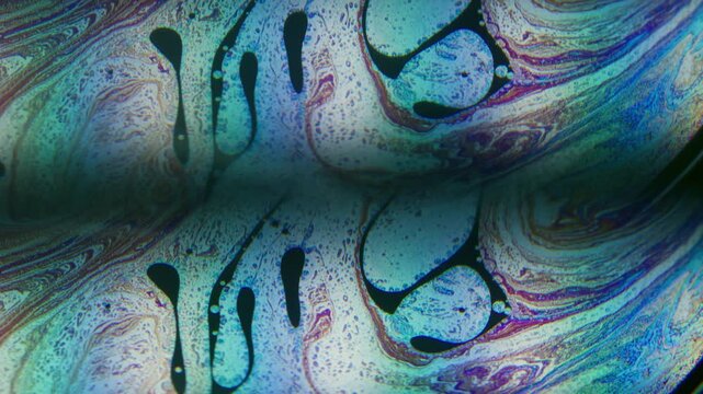 Dye water. Gasoline leak. Defocused blue pink purple color round bubble liquid paint blend wave floating on abstract art background