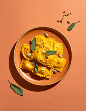 Artisanal pumpkin tortelli pasta with glossy sage butter sauce
