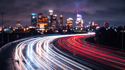 Cityscape at Night with Streaking Car Lights on Highway © Buxuan