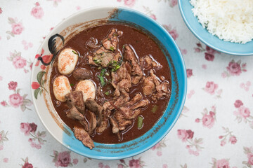 Noodles with beef served with cooked rice, Thai style. Thai people call Boat Noodles, asian food. Top view © Dontree