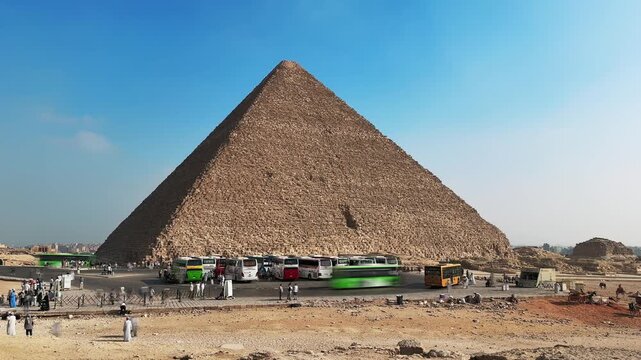 Timelapse of Tourist Buses and Crowds Arriving at the Great Pyramid of Khufu at Giza Necropolis