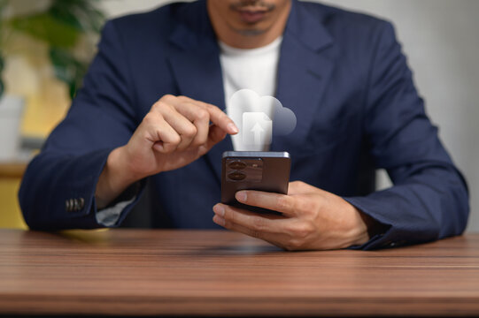 Business Professional Using Smartphone with Cloud Computing Icon Indoor