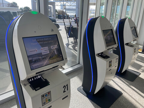 charleston, United States - November 7 2022: Self service check-in kiosks stand ready for travelers at Charleston International Airport.
