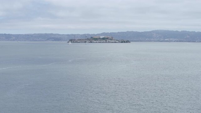 Aerial View Of Alcatraz Island In San Francisco Bay With Seagulls Surrounding Fishing Vessel