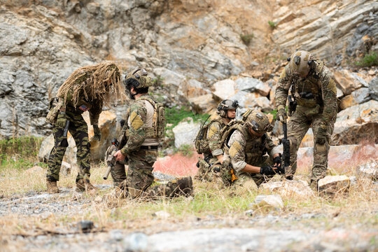 Special forces team establishes defensive positions during a military field exercise
