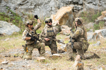 Fototapeta premium Military personnel conduct a tactical briefing and mission coordination meeting