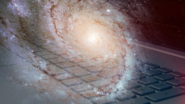 Sipiral galaxy on the laptop keyboard   "Elements of this image furnished by NASA "