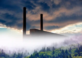 Smoke plume from ower plant emitting greenhouse gas into the atmosphere on forest trees background © muratart