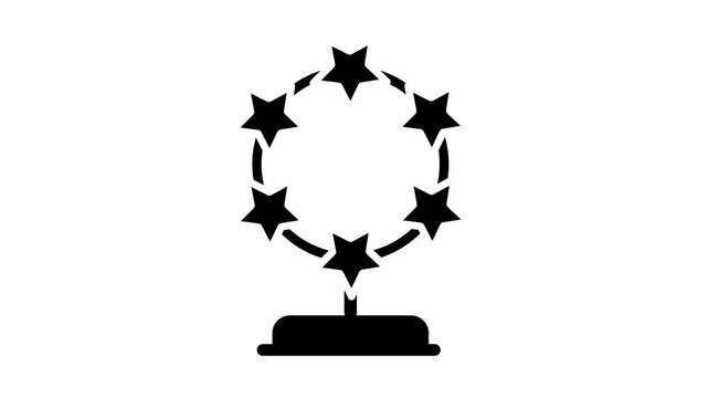 A circular wreath of stars arranged around a central figure on a pedestal representing a prestigious award or achievement symbol