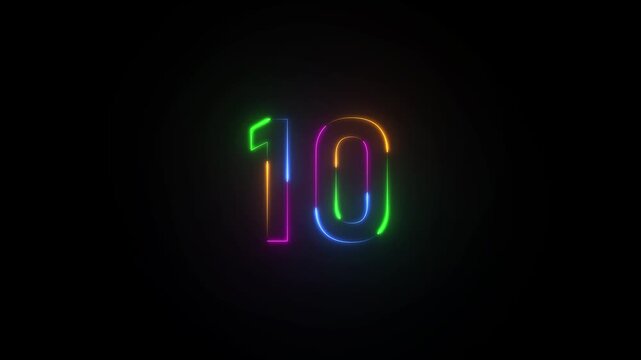 Neon number 10 glowing in green blue orange and pink lights on a dark backdrop image photo