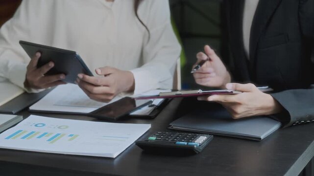 Financier team collaborates on project details in finance meeting session