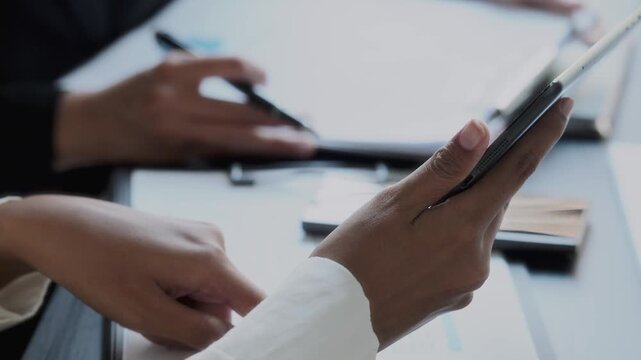 Financier team collaborates on project details in finance meeting session
