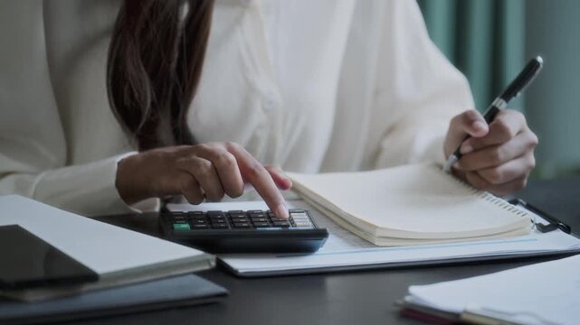 Professional accountant analyzing documents in office for precise valuation