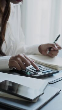 Professional accountant analyzing documents in office for precise valuation